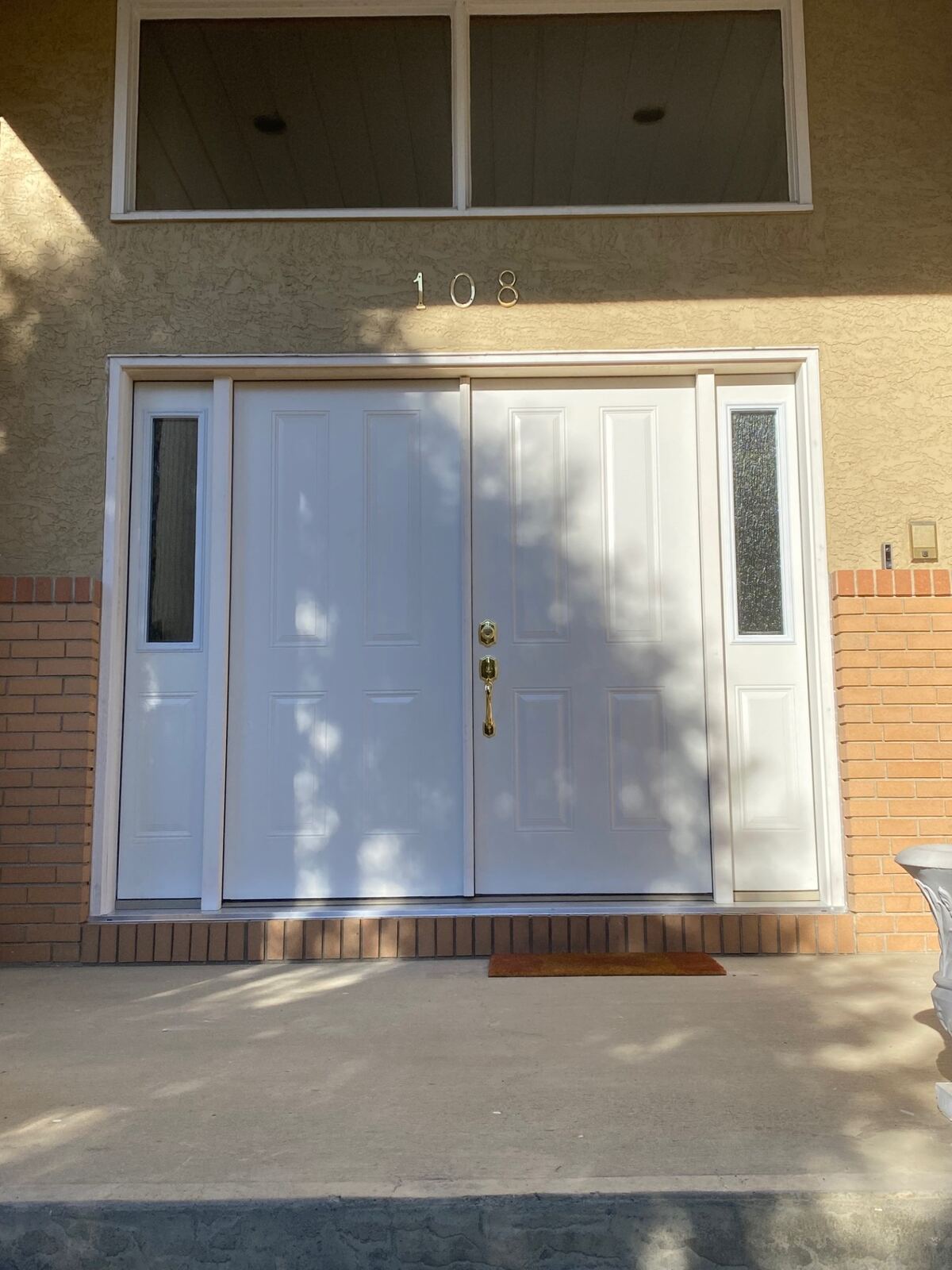 Double white entry doors with sidelites