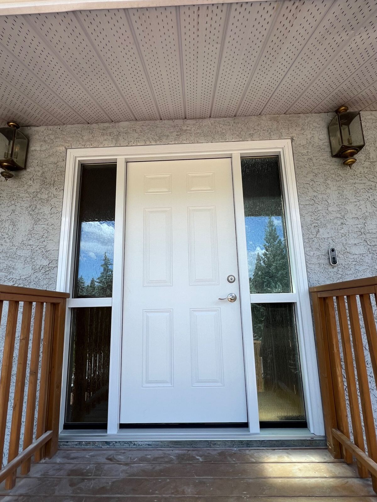 Classic six-panel door with full-height sidelites